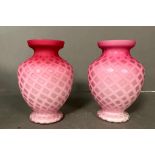 A pair of pink diamond quitted satin glass vases