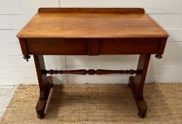 A Victorian style yew side table with two drawers at front, gallery top with turned cross