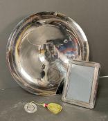 A Christofle centerpiece bowl, photograph frame and bookmark.
