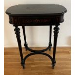 An ebonised Napoleon III style dressing table with fitted interior and internal mirror on hinged lid