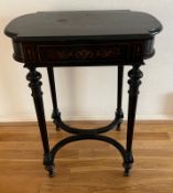 An ebonised Napoleon III style dressing table with fitted interior and internal mirror on hinged lid