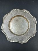 A small silver pin coaster by Goldsmiths and Silversmiths, hallmarked for London 1905 (13cm