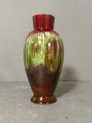 A contemporary vase on red grounds.H 24cm