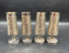 A set of four of silver vases by C J Vander Ltd with textured decoration hallmarked for London for