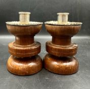 A Pair of turned wood and silver candlesticks by Horace Woodward & Co Ltd, hallmarked for London