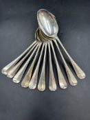 A set of ten silver spoons, approximate total weight 760g, by William Hutton & Sons Ltd,