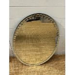 An oval wall mirror with tiled mirror edge (80cm x 51cm)