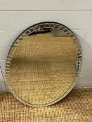 An oval wall mirror with tiled mirror edge (80cm x 51cm)
