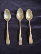 Three George II silver spoons, hallmarked for London 1744, various makers, approximate total