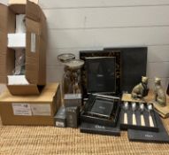 A selection of OKA interior items to include picture frames, bookends and lamps.