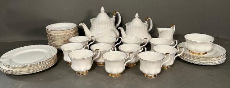 A part Royal Albert Val D'or tea service to include two tea pots, cups and saucers and side plates