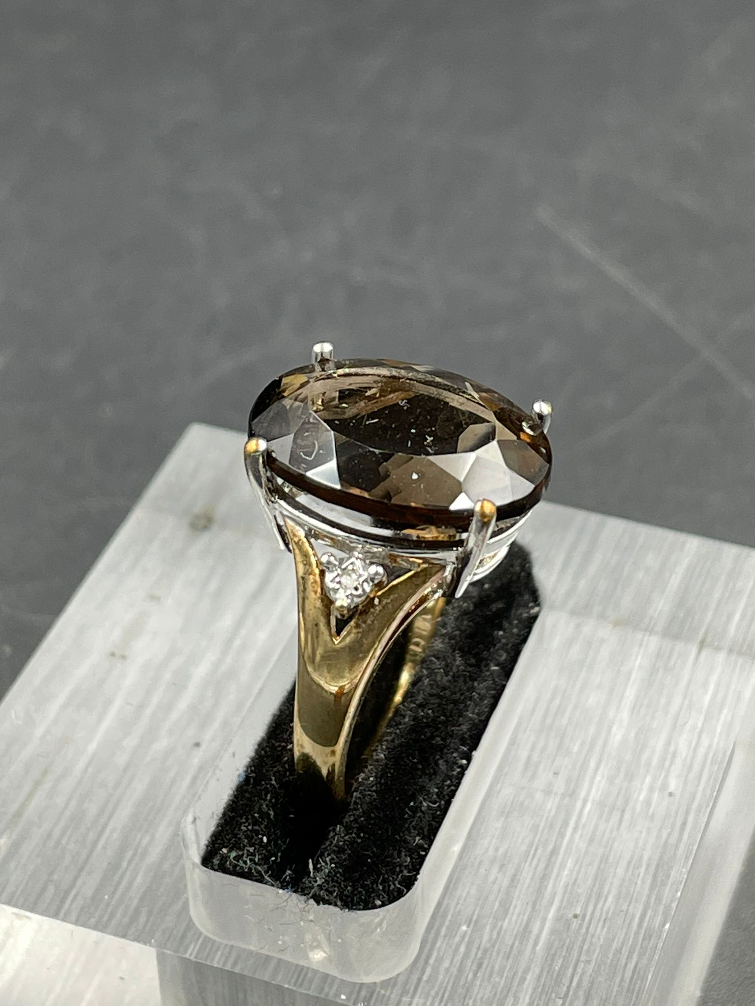 A smokey quartz and diamond ring, oval cut smoky quartz weighing on a 7.20ct claw set with a - Image 2 of 4