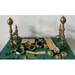 A selection of brass ironmongery including door bell buttons, letterbox, door knockers and fire