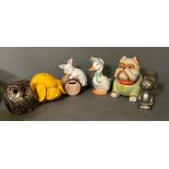 A selection of novelty money boxes to include a white metal Snoopy, an owl and a bull dog