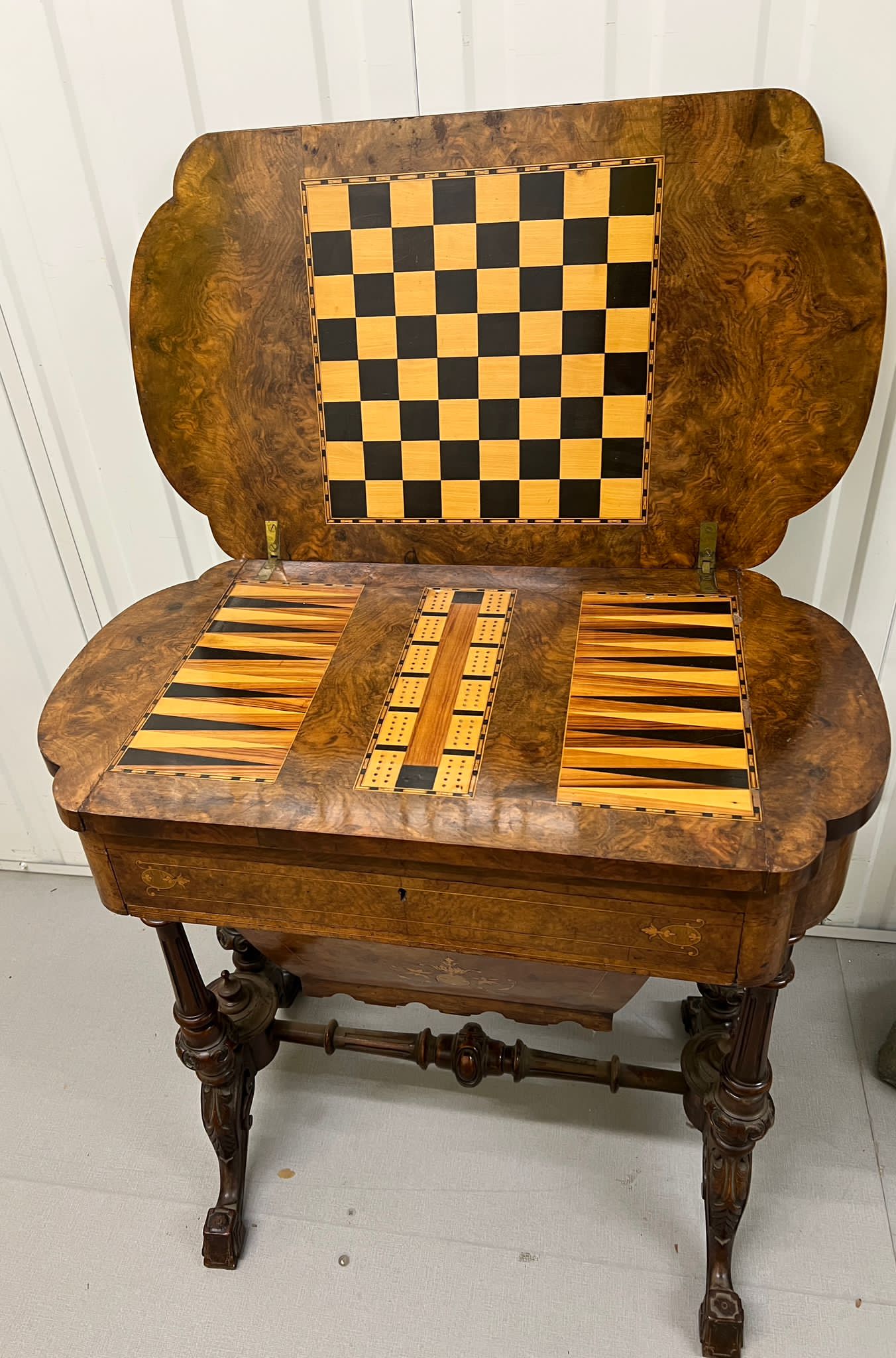 A Victorian Burr Walnut Games Table. The table top opens to reveal Chess, back gammon and cribbage - Image 5 of 8