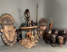 A selection of tribal Africana to include masks, busts and book ends