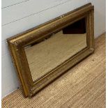 A gilt framed wall hanging over mantel mirror (63cm x 110cm)