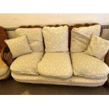 A Bergere sofa suite, consisting of a three seat settee and two arm chairs