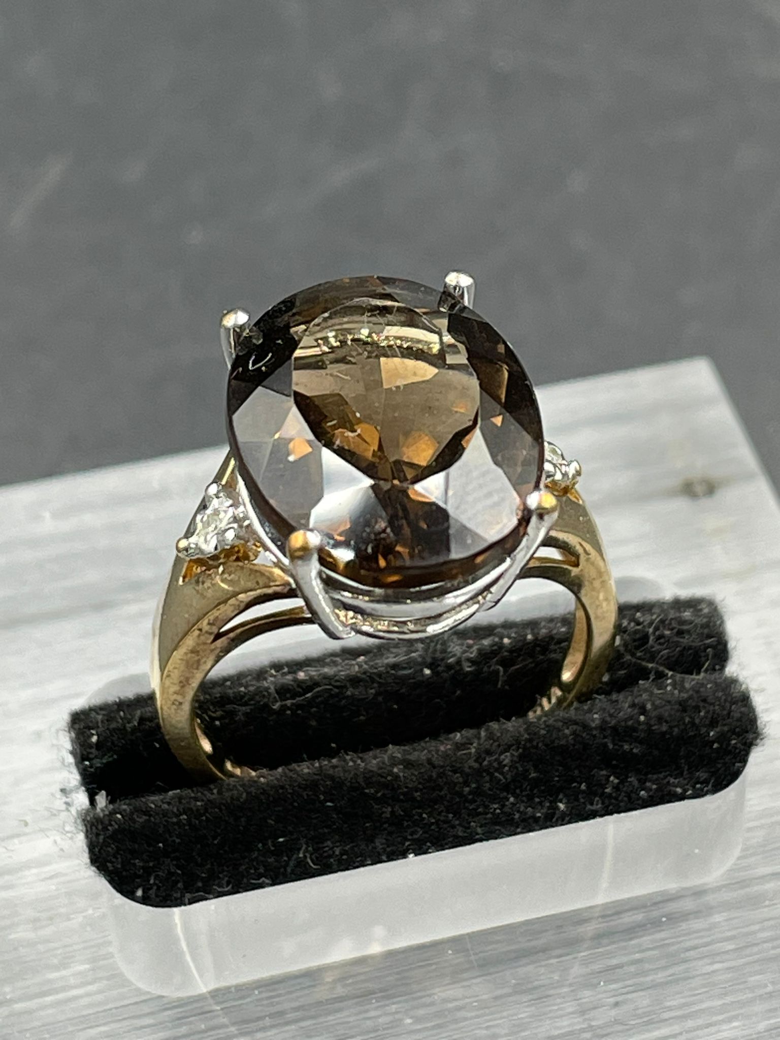 A smokey quartz and diamond ring, oval cut smoky quartz weighing on a 7.20ct claw set with a - Image 4 of 4