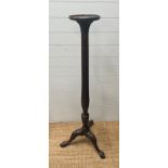 A mahogany torchere with fluted column on carved tripod legs and ball and claw feet (H 154cm)