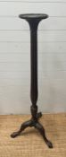 A mahogany torchere with fluted column on carved tripod legs and ball and claw feet (H 154cm)