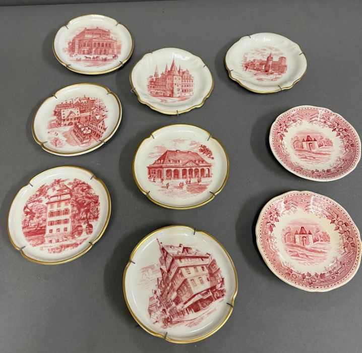 Seven miniature German picture plates and two others