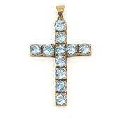 In 9 carat yellow gold a blue topaz set cross