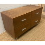 A contemporary four drawer chest of drawers (H66cm W120cm D52cm)