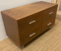 A contemporary four drawer chest of drawers (H66cm W120cm D52cm)