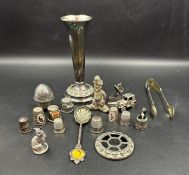 A selection of white metal curios including several silver an iron and a car.