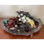 A white metal tray with glass and stone fruit