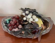 A white metal tray with glass and stone fruit