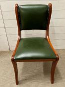 A green faux leather desk chair