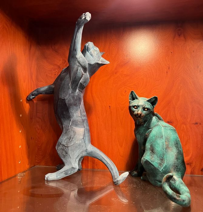 Two statues of cats