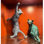 Two statues of cats