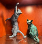 Two statues of cats