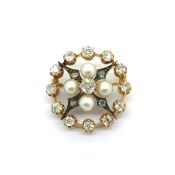 Antique circular brooch set with old cut diamonds and natural pearls. Tested as high carat gold with
