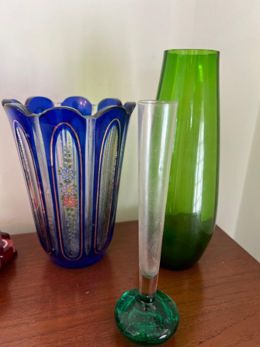 Three pieces of coloured glass vases, various ages