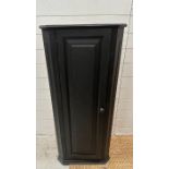 A black painted three shelf corner cabinet Height 117cms