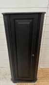 A black painted three shelf corner cabinet Height 117cms