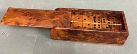 A walnut cased set of dominoes