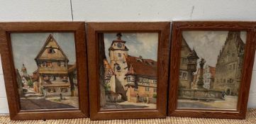 Three pine framed watercolours of German town scenes.