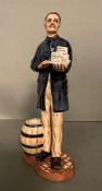 A Coalport ceramic figure "The Music Seller"