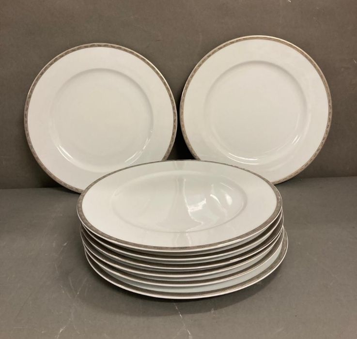 A set of eight LSA dinner plates