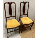 A pair of Chippendale style Edwardian side chairs