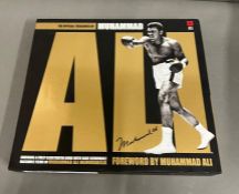 Hard back book "The Offical Treasures" of Muhammad Ali