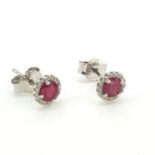 In 9 carat white gold a pair of ruby and diamond round earrings Ruby 0.84 Diamond 0.09