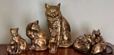 A selection of brass cats