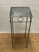 A small metal side table