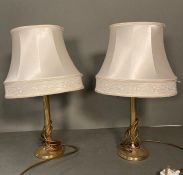 A pair of brass empire column style table lamps